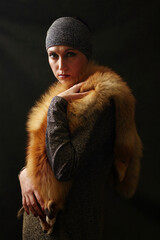 The beautiful woman in a collar from the fox fur