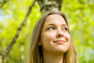 Naklejka premium Young Blond Woman In The Forest