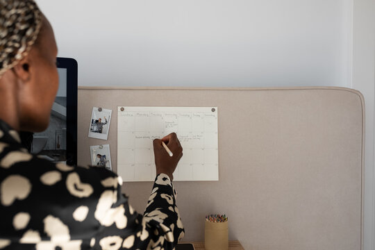 Crop female manager planning working week