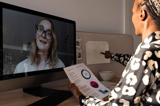 Black Woman Checking Schedule During Online Meeting