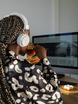 Black freelancer having teatime at home