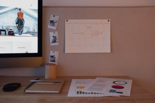 Creative workplace with schedule on pin board