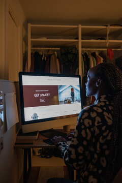 Black female freelancer working at night