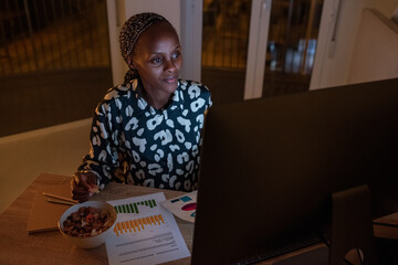 Smiling black businesswoman working on startup project