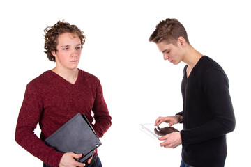 Two young attractive students with a laptop.	