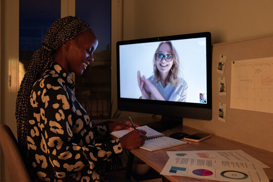 Smiling black businesswoman having online consultation - Powered by Adobe