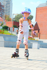 smiling 5 year old girl speedy going on her in-line skates