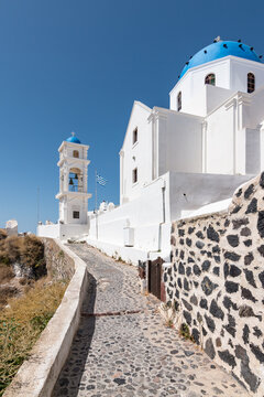 Path to white church on Santorini island, Greece. 