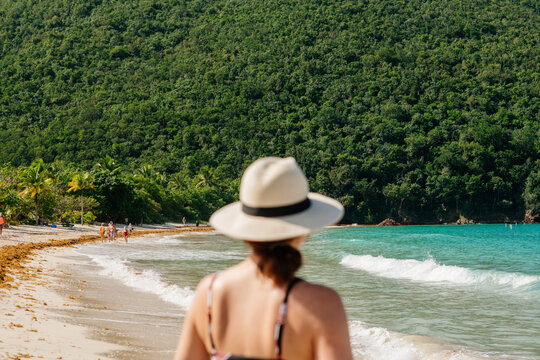 Woman walking on a beach in St. Thomas
