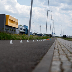 Colorful slalom poles on the obstacle track for roller skaters