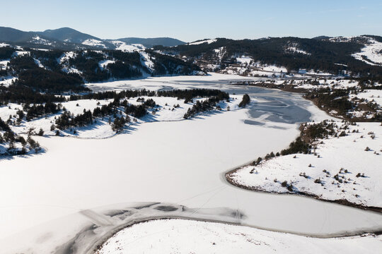 Frozen lake mountain winter snow landscape - Powered by Adobe
