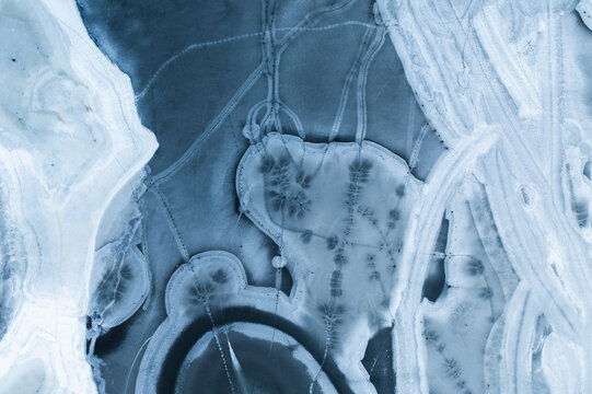 2d top shot frozen ice pattern on lake winter 