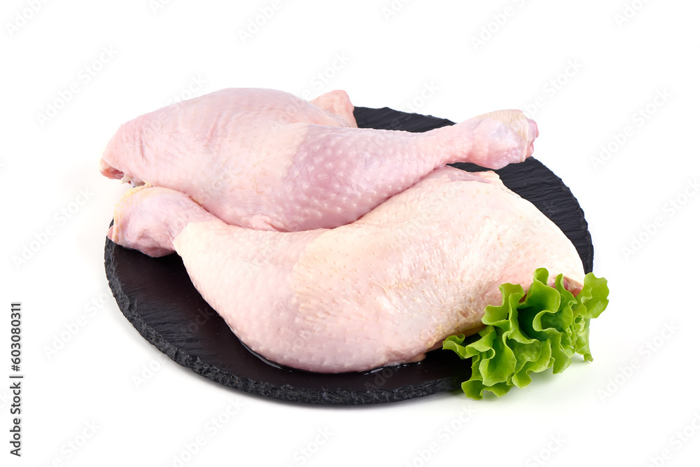 Wall mural Raw chicken leg quarters, isolated on white background.