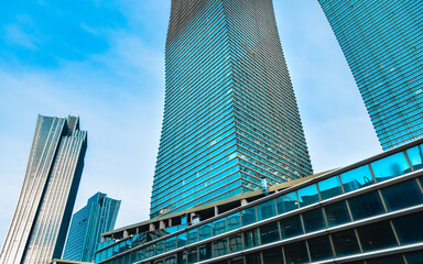A look at a modern glass skyscraper in the city center. Finance center