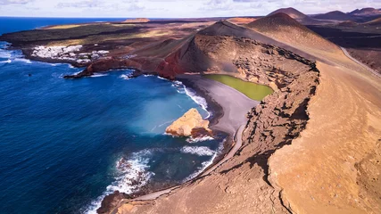 Foto op Canvas Lanzarote, Canary islands scenery. Aerial drone view of El Golfo with volcanic green lake Lago Verde and black sandy beach.. © Freesurf