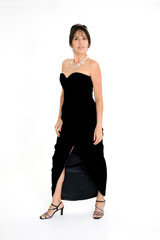 Beautiful Hispanic woman in a black evening gown on a white background