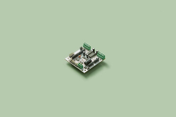 Single electronic microchip on green background.