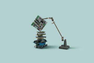 Circuit board held by holder over computer chips.