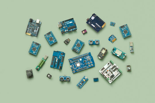 Electronic chips scattered on green background.