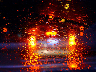 Fototapeta na wymiar Driving in the rain at night