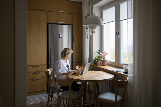 Woman working at the table at home