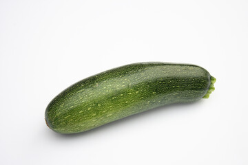 On a photo a vegetable marrow. The photo is isolated