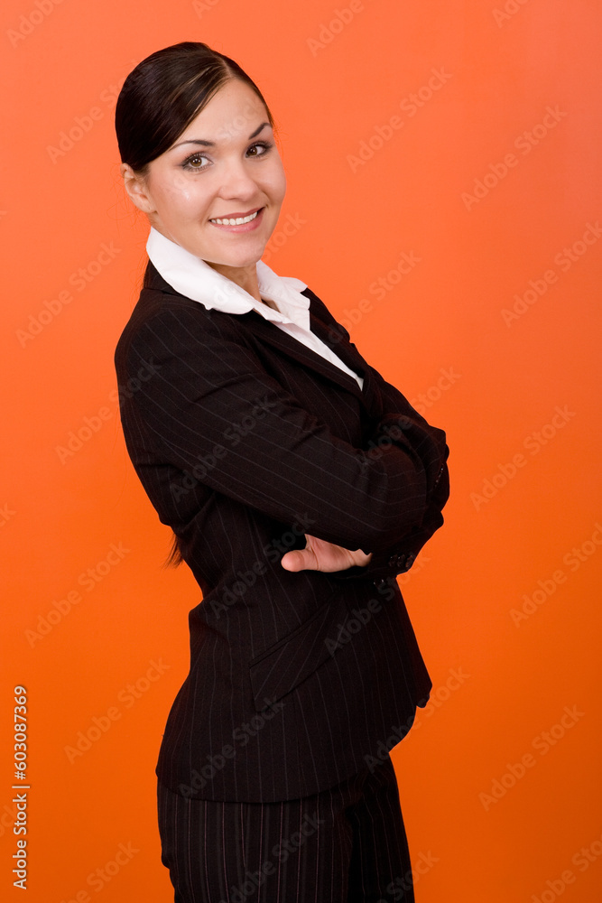 Wall mural attractive brunette woman on orange background