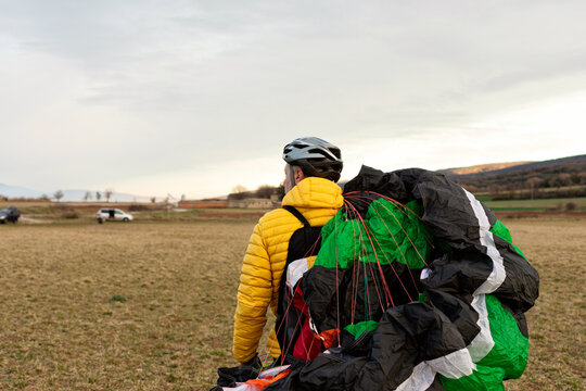 man holding a parachute 