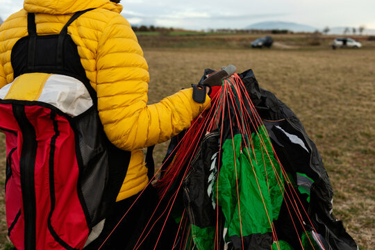 man holding a parachute 