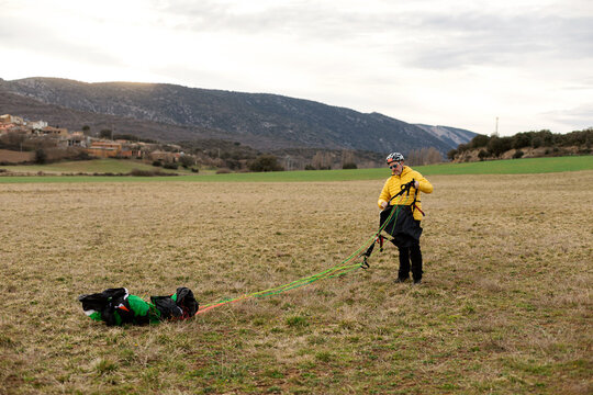 man during parachute landing 