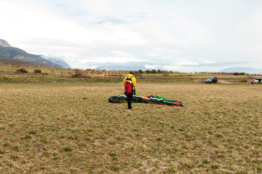 man after parachute landing 