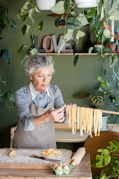 Woman Making Homemade Tagliatelle