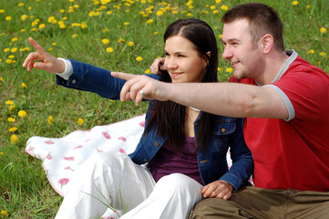 happy couple on green meadow