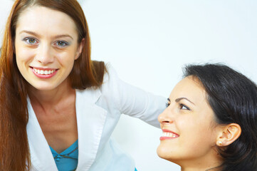 portrait of two young woman on white back