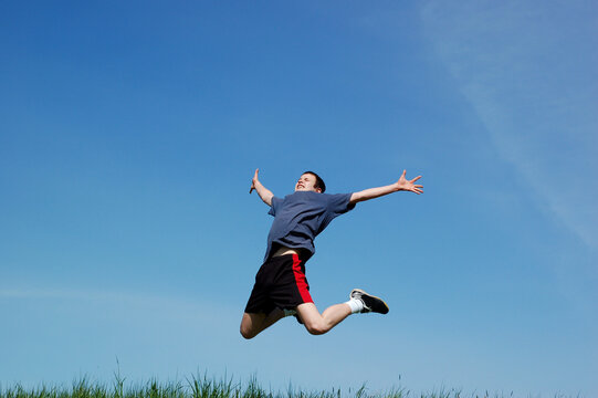 happy jumping kid on sky background