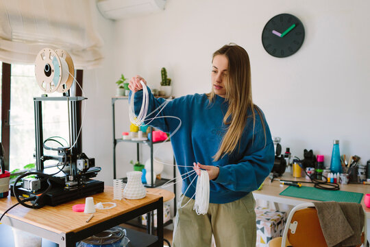 Woman prepares material for craftwork
