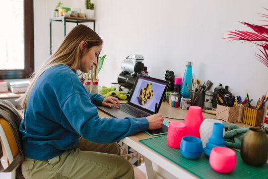 Woman designing on a laptop