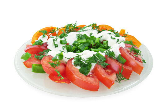 Vegetable salad of tomatoes, sweet peppers, spring onions, dill and sour cream