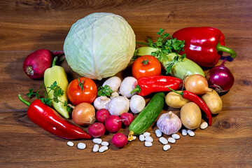 Still life of fresh vegetables on a wooden table.