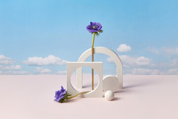 White cement elements with purple flowers.