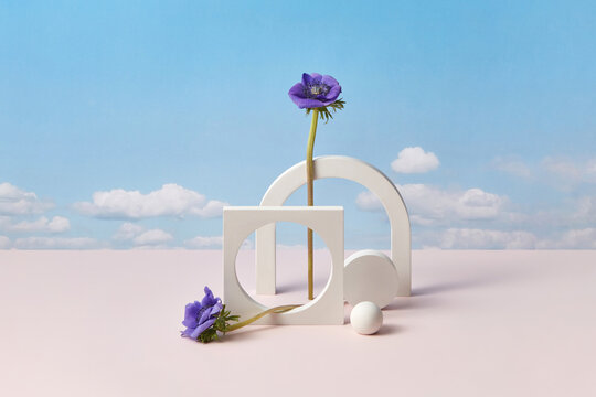 White cement elements with purple flowers.