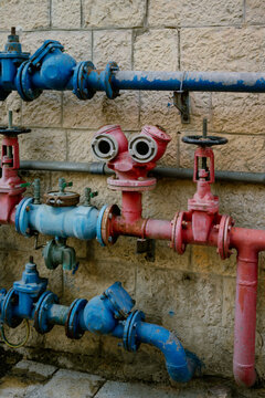 Colored pipes of communications near the wall