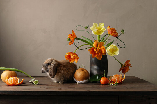 Portrait of brown rabbit with flowers