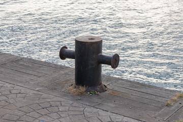 wharf anchor used to moor the ship. Selective focus, noise effect.