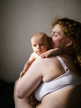 Mother Kissing Her Little Baby