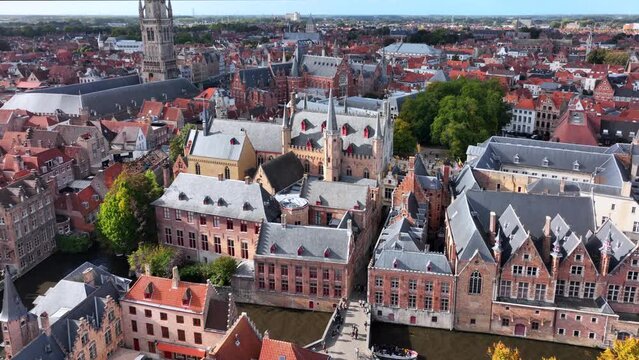 Aerial drone shot of Bruges in Dutch Brugge is the Beautiful Medieval Historical City. Architecture and channels.