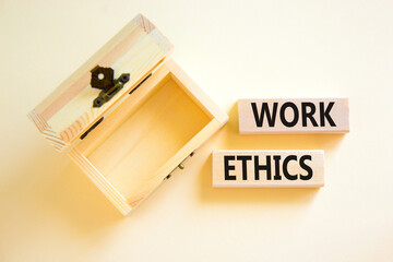 Work ethics symbol. Concept words Work ethics on beautiful wooden block. Beautiful white table white background. Empty wooden chest. Business and Work ethics concept. Copy space.
