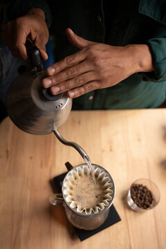 Anonymous man making hot coffee