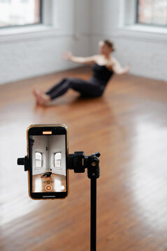 Phone on a tripod, video shooting training in the gym