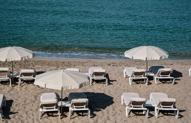 Fototapeta na wymiar beach chairs and umbrellas